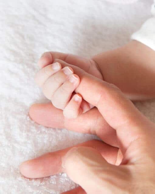 Holding New Born Finger | Ten True Things About the First Year of Parenthood