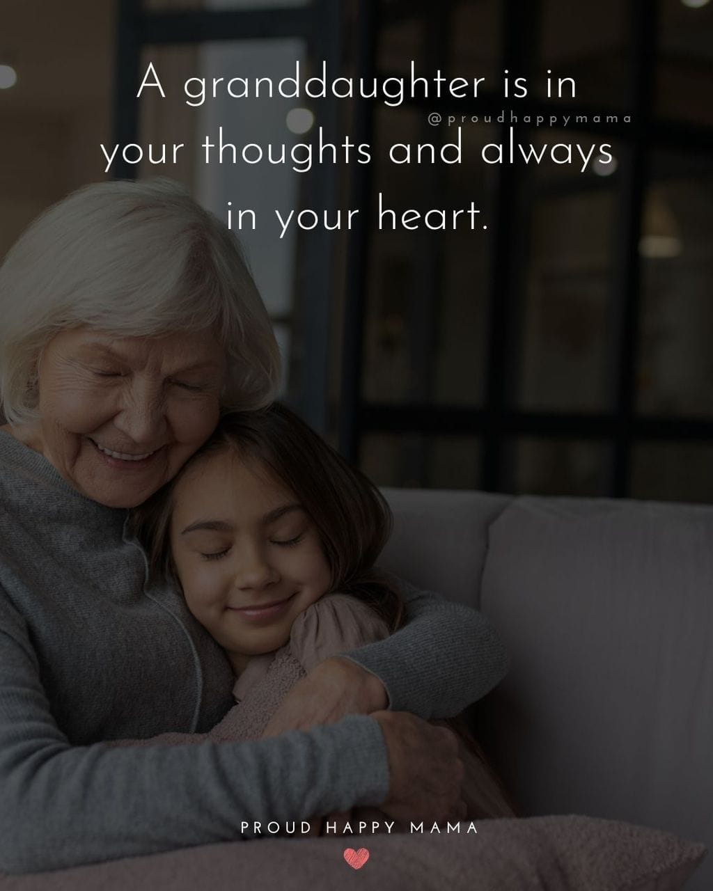 Granddaughter and grandmother hugging while sitting on couch. Text overlay, ‘A granddaughter is in your thoughts and always in your heart.’