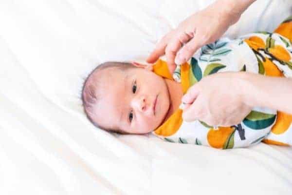 what should baby wear under swaddle