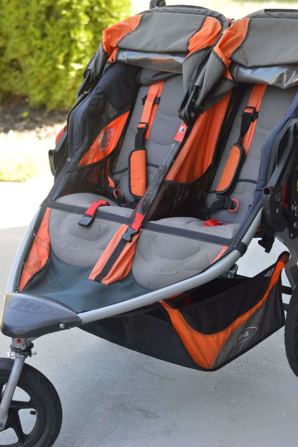 BOB Gear Revolution Flex 3.0 double jogging stroller in burnt orange and black design.