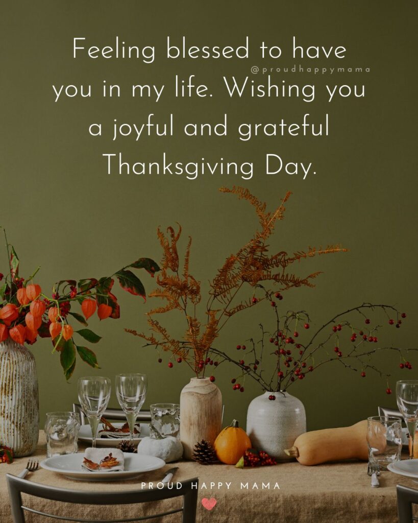 Thanksgiving quote overlay that reads “Feeling blessed to have you in my life. Wishing you a joyful and grateful Thanksgiving Day.” with an elegant fall table setting decorated with pumpkins, flowers, and candles.
